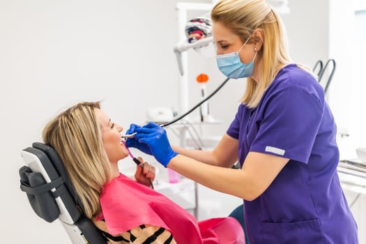 Dentist drilling the teeth of the patient. photo
