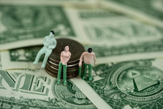 three figures with US Banknotes photo