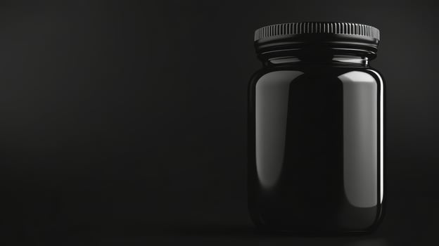 Empty black medicine jar isolated photo