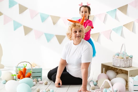 Easter concept. Happy llittle girl and grandmother with Easter eggs photo