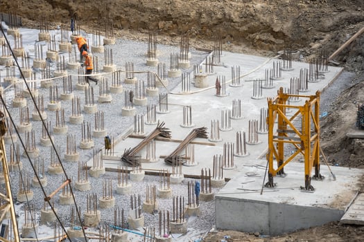 Laborers working on modern constraction site works in Dubai. Fast urban development consept. photo