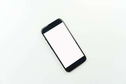 Black smartphone with blank screen on white background photo