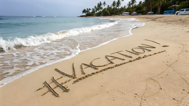 Sandy beach with gentle waves, palm trees, and vacation written in the sand, evoking a serene tropical getaway. photo