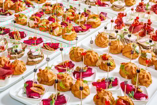 Catering buffet or service with different snacks, appetizers and canapes on a table. Variety of Freshly Prepared Catering Food for an Event. photo