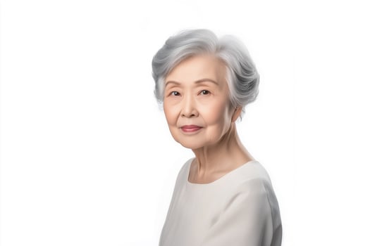 An older woman with white hair and a white shirt photo