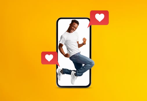 A person excitedly interacts with love messages displayed on a smartphone. The cheerful atmosphere highlights the joy of connecting through technology, especially to celebrate Valentines Day. photo