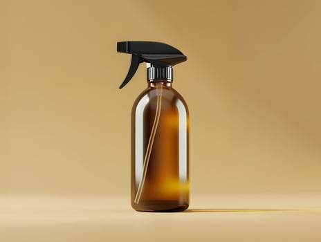 A brown spray bottle with a black spray nozzle photo