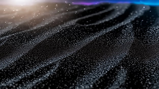 Close-up view of shimmering black sand dunes under soft lighting with a dreamy atmosphere photo