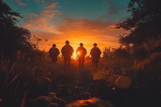 Military Soldiers Walking at Sunrise in Scenic Outdoor Landscape photo