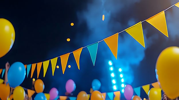 Colorful balloons and festive bunting at a vibrant night celebration with bright lights photo