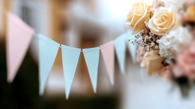 Colorful decorative bunting and bouquet of roses at a festive outdoor celebration setting photo