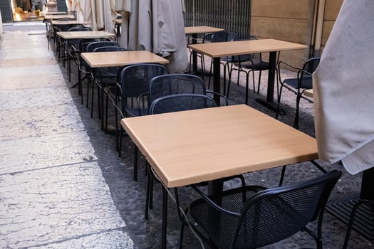 Terrace with tables and chairs in the street photo
