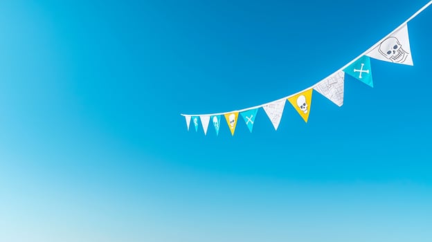 Colorful pirate-themed bunting flags hanging against a bright blue sky, creating a festive atmosphere photo
