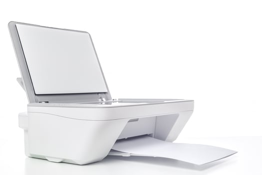 Modern white printer scanning documents with an open lid and paper ready for output photo