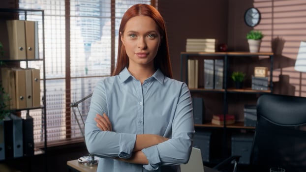 Confident Caucasian business woman girl female businesswoman employer entrepreneur manager company worker bank consultant in office crossed hands folded arms on chest confidence looking at camera photo