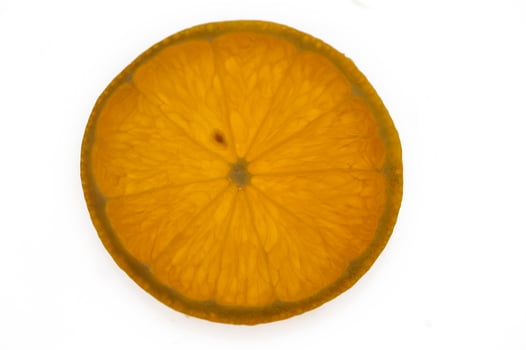 Vibrant orange slice revealing intricate details against a bright background photo