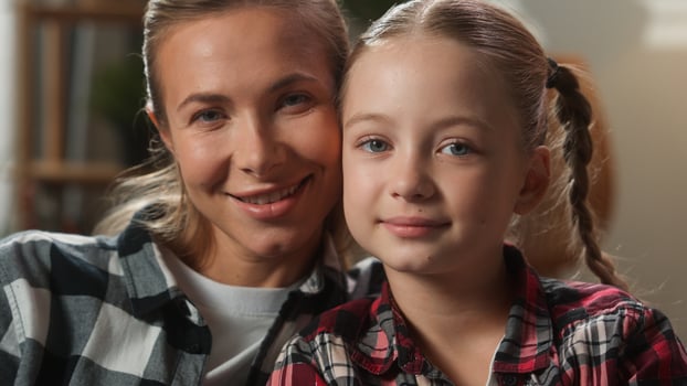 Happy Caucasian family portrait faces at home mortgage insurance together looking at camera smiling mother woman female mom with child kid girl daughter love adopt custody childcare motherhood bonding photo