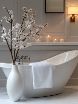 Luxurious bathroom design with white freestanding bathtub and elegant decor photo