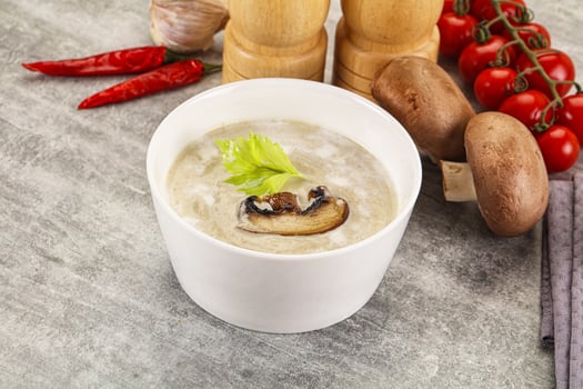 A bowl of soup with mushrooms and vegetables photo