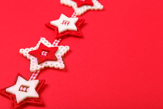 Christmas garland on a red background a close up photo