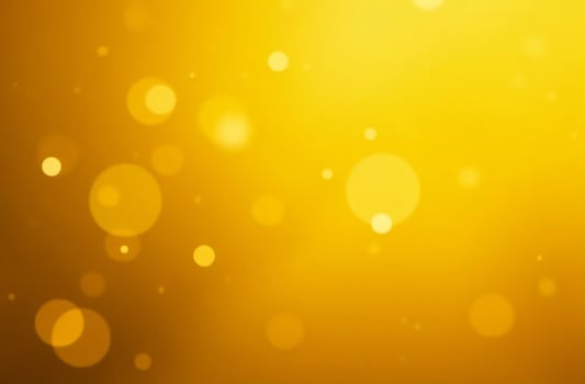Abstract background round sparkling bokeh lights moves yellow background photo