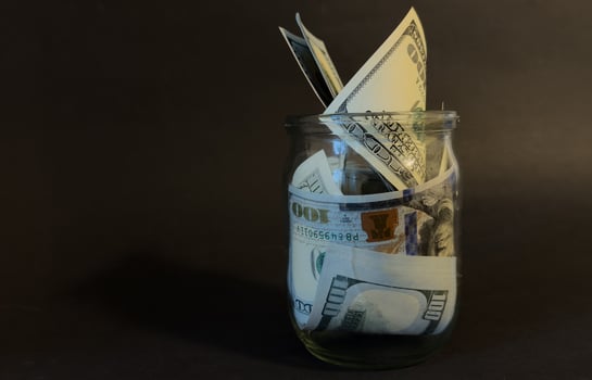money in the glass with filter effect retro vintage style photo