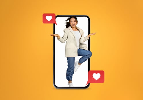 A person joyfully interacts with a smartphone, embodying the excitement of social media communication about love and connections in the digital age. The bright background adds to the uplifting vibe. photo