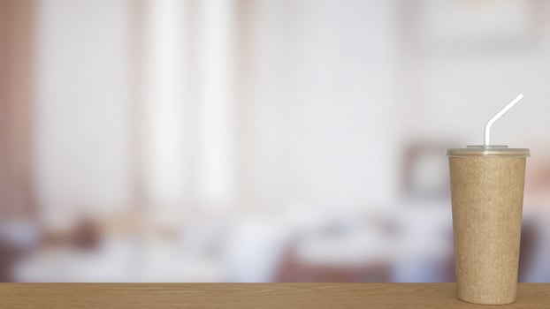 Coffee paper cup on wood Table . photo