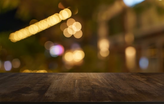 empty wooden table top on blurred background of night city photo