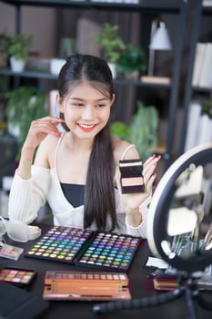 beauty and makeup concept, asian woman with makeup and cosmetics at home photo