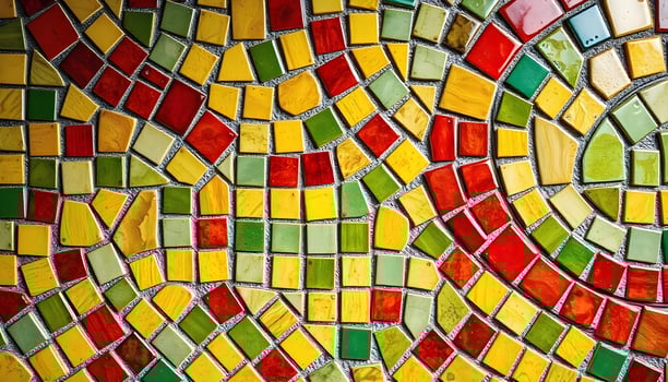 Colorful mosaic pattern with yellow, red, green, and gray tiles arranged in a circular design photo