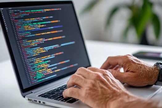 Person Coding on Laptop, Bright Light photo