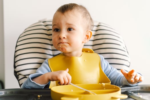 Little child with solid nutrition. photo