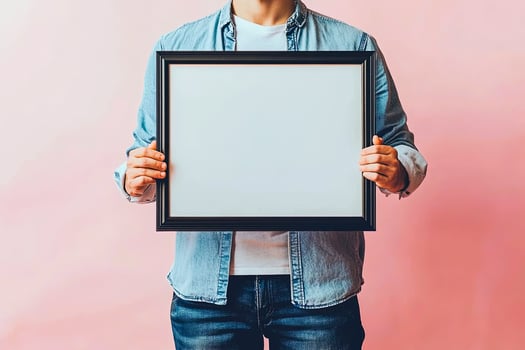 Man Holding Blank Picture Frame photo