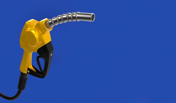 Yellow fuel nozzle on blue background photo