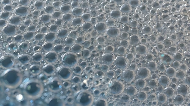 A close-up of plastic wrap with delicate air pockets, resulting in a soft, textured look. photo
