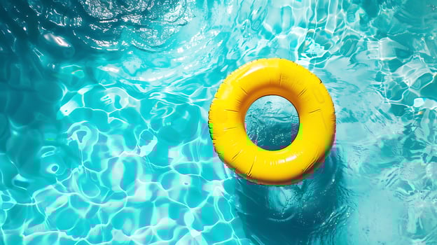 Inflatable ring floating in swimming pool, summer vacation concept. photo
