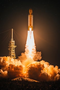 Space shuttle launching into space at night with smoke and fire photo