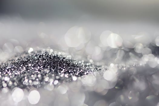 Shimmering silver glitter with soft bokeh effect in a dreamlike scene photo