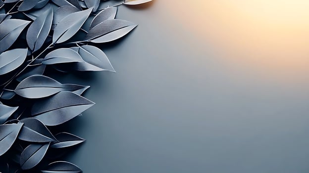 A serene arrangement of dark leaves on a smooth surface with a warm glow in the background photo