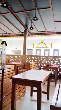 Wooden chairs and tables in the cafe. photo