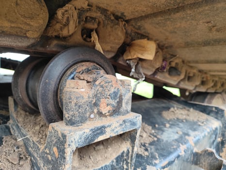 Excavator Machinery Parts in Focus Engine, Pipes, and Hydraulic Hoses photo