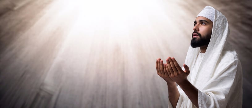 Middle Eastern Muslim man in prayer. Devotion to Allah and Islamic religious practices. Copy space photo