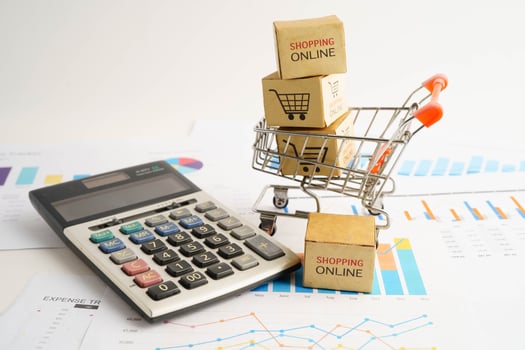 Online shopping, Shopping cart box on business graph photo