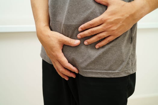 Hernia, Asian man stomach ache, abdominal pain photo