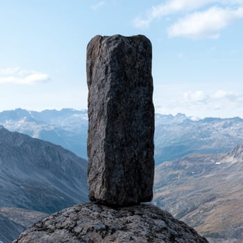 Balanced rock formation in a mountain landscape photo