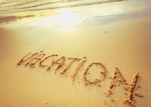 Written message about vacation on sandy beach during sunset, capturing a moment of relaxation and joy photo