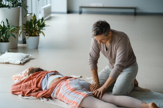 Relaxation therapy session taking place in a serene indoor studio with plants, focusing on wellness and rejuvenation in a tranquil environment. photo