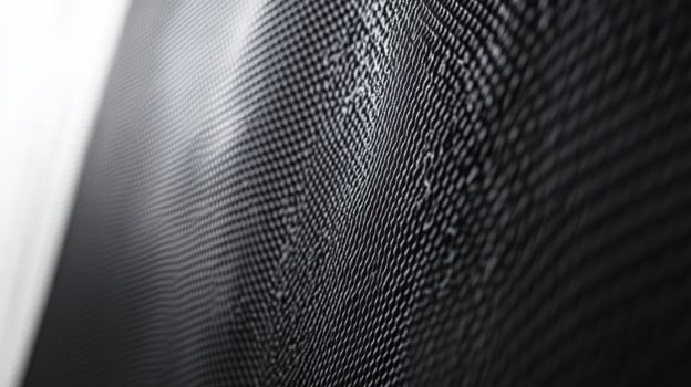 Wavy black grid reflecting light creating abstract pattern photo