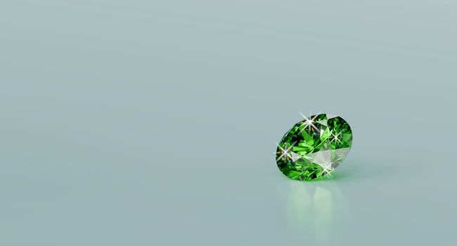 Green diamond emerald isolated on glossy background 3d rendering photo